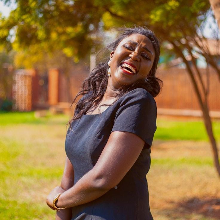 Kaveri Mehta, Lead Design Curator at ForestGroveHarbor, reviewing corporate floral arrangements